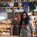 Leeann Thomas, the owner of the Triangle Club for the last 25 years, stands behind the bar with her employee Dita Sharpley on Tuesday. (Jasz Garrett / Juneau Empire)