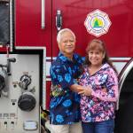 Retired Capital City Fire/Rescue Assistant Chief Ed Quinto stands with his wife, Andrea, during his retirement celebration on Saturday. He said it was because of his wifes support that he could have a successful career. (Jasz Garrett / Juneau Empire)