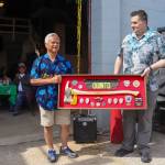 Capital City Fire/Rescue Fire Chief Rich Etheridge recognizes retired CCFR Assistant Chief Ed Quinto for his 45 years of service on Saturday outside of the Hagevig Regional Fire Training Center. (Jasz Garrett / Juneau Empire)