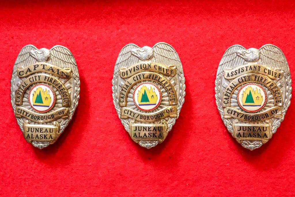 The badges of retired Capital City Fire/Rescue Assistant Chief Ed Quinto. (Jasz Garrett / Juneau Empire)