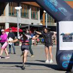 Isabella Lang gets an enthusiastic greeting as she finishes first overall in the Olympic distance in Aukeman Triathlon on Sunday. (Photo by Bob Eastaugh)
