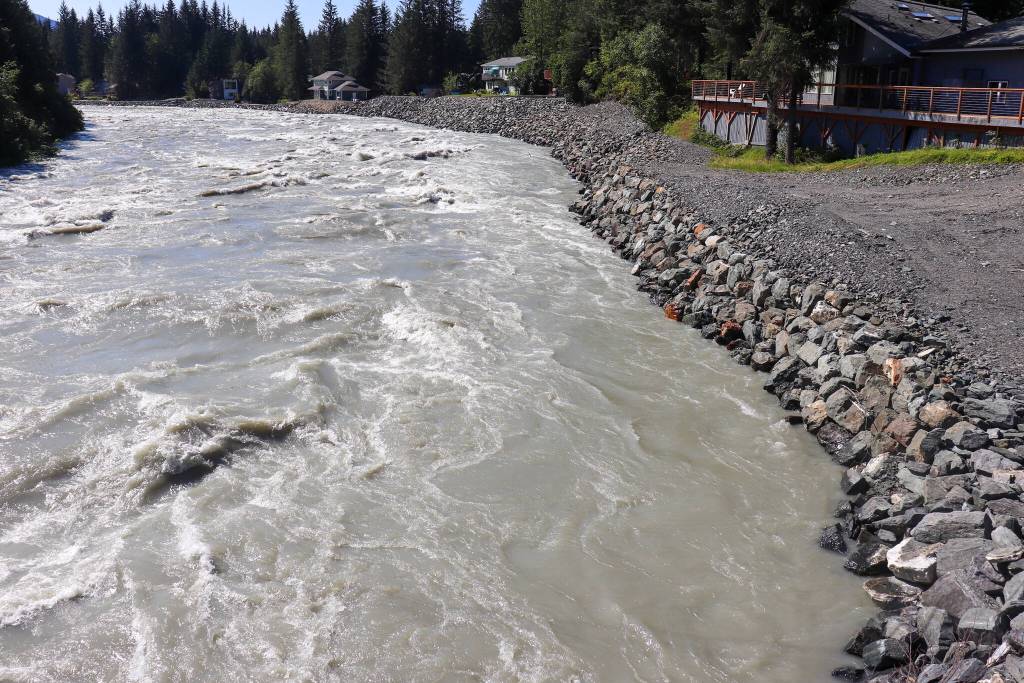 The Mendenhall River reached 10 feet at 12:20 p.m. on Monday. This photo was taken approximately at 12:30 p.m. and shows the Mendenhall River rising over rock fill placed last year to reinforce the riverbanks. (Jasz Garrett / Juneau Empire)