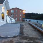 Homes and condominiums along Riverside Drive that suffered major damage during last years flooding of the Mendenhall River remain high above the water level and well protected by a rock-reinforced riverbank as the river nears its expected crest Monday night. (Mark Sabbatini / Juneau Empire)