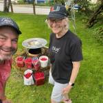 Marc Wheeler, formerly of Coppa, and his Flats neighbor Nancy Hemenway proudly show 50 pounds of cherries they harvested during the bumper-crop summer of 2023. Wheeler created cherry ice cream for his restaurant customers that year. (Laurie Craig / Juneau Empire)