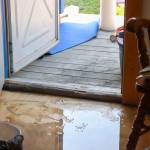 A pool of water is seen inside Debora Gerrishs house on Tuesday afternoon. (Jasz Garrett / Juneau Empire)