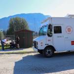 Jimmy Brackett, a homeowner on Long Run Drive, signs up for help with the United Way of Southeast Alaska on Thursday morning. (Jasz Garrett / Juneau Empire)