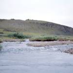 A creek runs beside the Mesa Site in northern Alaska. (Photo by Dan Gullickson)