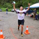 Seth Nolen celebrates winning the 25K course of the Nifty Fifty race on Saturday. (Mark Sabbatini / Juneau Empire)