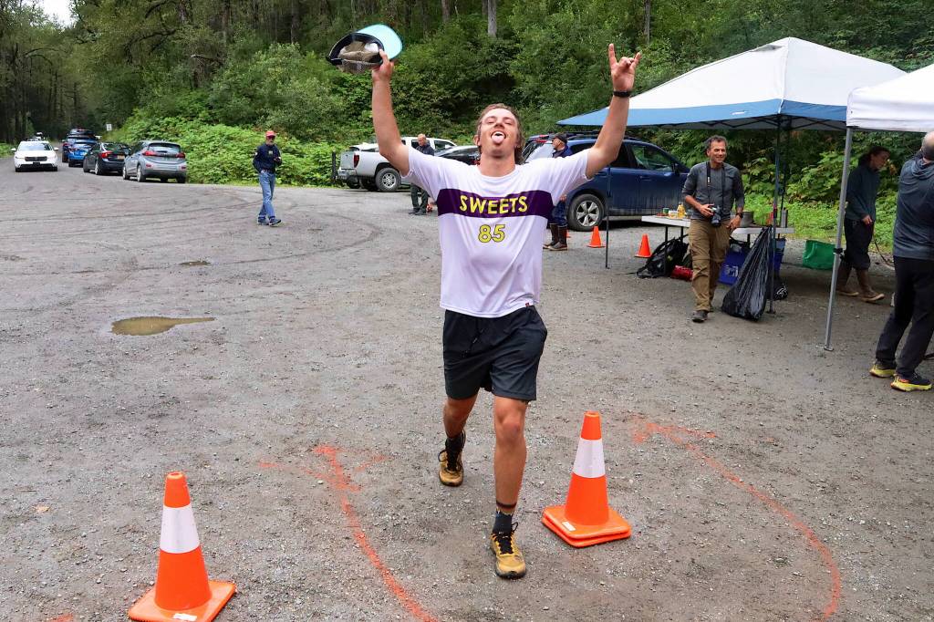 Seth Nolen celebrates winning the 25K course of the Nifty Fifty race on Saturday. (Mark Sabbatini / Juneau Empire)