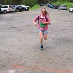 Caitlyn Fleischman makes the final dash for the finish line to win the womens 25K course during the Nifty Fifty race on Saturday. (Mark Sabbatini / Juneau Empire)