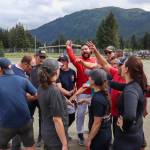 Capital City Fire/Rescues softball team celebrates after their win against the Juneau Police Department and Alaska State Troopers. (Jasz Garrett / Juneau Empire)