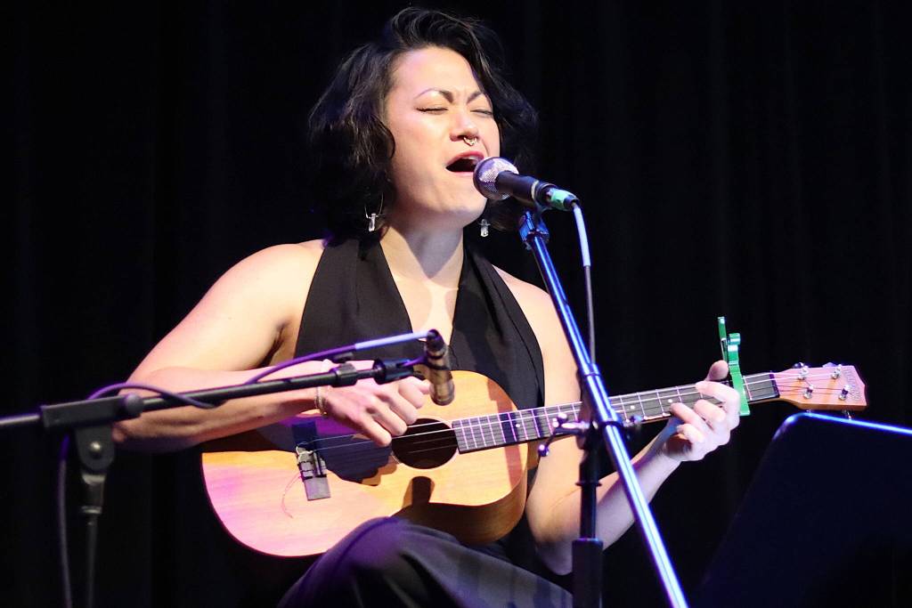 Lisa Puananimōhalaʼikalani Denny performs a song written for Steven Kissacks husky/malamute companion Juno during Voices for Steve: A Memorial Benefit Show at the Crystal Saloon on Saturday night. (Mark Sabbatini / Juneau Empire)