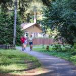 Piper Blackdiehl and Randy Stichert (front) finish their practice race on Monday. (Jasz Garrett / Juneau Empire)