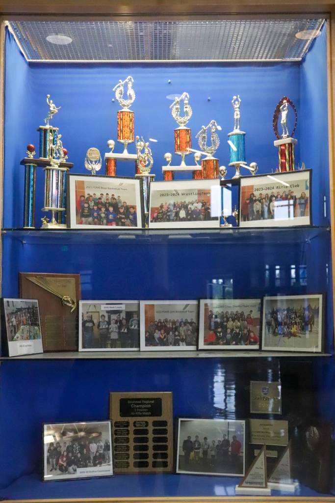 The Floyd Dryden Middle School trophy case is on display at Thunder Mountain Middle School. A Dzantiki Heeni Middle School trophy case will be on display soon. (Jasz Garrett / Juneau Empire)