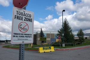 A sign at Anchorages Service High School, seen on Aug. 13, 2024, explains that tobacco use is prohibited at the property. High school students use of electronic cigarettes has declined since 2019, one of the positive trends emerging from the latest Alaska Youth Risk Behavior Survey. (Yereth Rosen/Alaska Beacon)