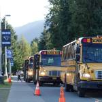 Falcons banners continue to fly as buses drop off students at the newly named Thunder Mountain Middle School on the first day of school Thursday, as the high school students in the building last year have now been consolidated into Juneau-Douglas High School: Yadaa.at Kalé. (Mark Sabbatini / Juneau Empire)