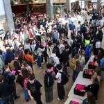 Students crowd into the commons area of Juneau-Douglas High School: Yadaa.at Kalé to pick up their schedules, and meet familiar and new peers, before classes start on the first day of school Thursday morning. (Mark Sabbatini / Juneau Empire)