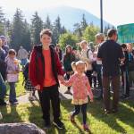 Chase Van Linden and Eliana Porter, the oldest and youngest student, start the first day of school for Montessori Borealis Public Alternative School on Thursday morning by being the first two to walk through the doors. (Jasz Garrett / Juneau Empire)