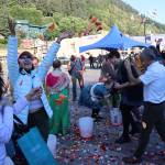 People throw rose petals in the air during a celebration of Indias Independence Day on Friday at Elizabeth Peratrovich Plaza. (Mark Sabbatini / Juneau Empire)