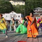 Nimmy Philips (wearing orange) leads a Bollywood flash mob during a celebration of Indias Independence Day on Friday at Elizabeth Peratrovich Plaza. The event was hosted by downtown businesses who presented a $10,000 donation to the Juneau Community Foundation to aid people affected by record flooding of the Mendenhall River earlier this month. (Mark Sabbatini / Juneau Empire)