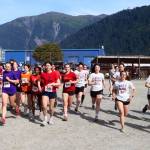 Juneau high school students and alumni take off from the starting line in the womens 5K race of the Sayéik Invitational at Savikko Park on Saturday morning. The unofficial meet was the first event of the season for the cross-country team newly consolidated Juneau-Douglas High School: Yadaa.at Kalé. (Mark Sabbatini / Juneau Empire)