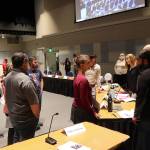 Residents talk to city leaders and other officials about the response to this years record flooding from Suicide Basin during a Juneau Assembly meeting Monday night at Centennial Hall. (Mark Sabbatini / Juneau Empire)