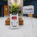 A sign inside the Mendenhall Mall Annex points toward a polling place on Tuesday morning. (Jasz Garrett / Juneau Empire)