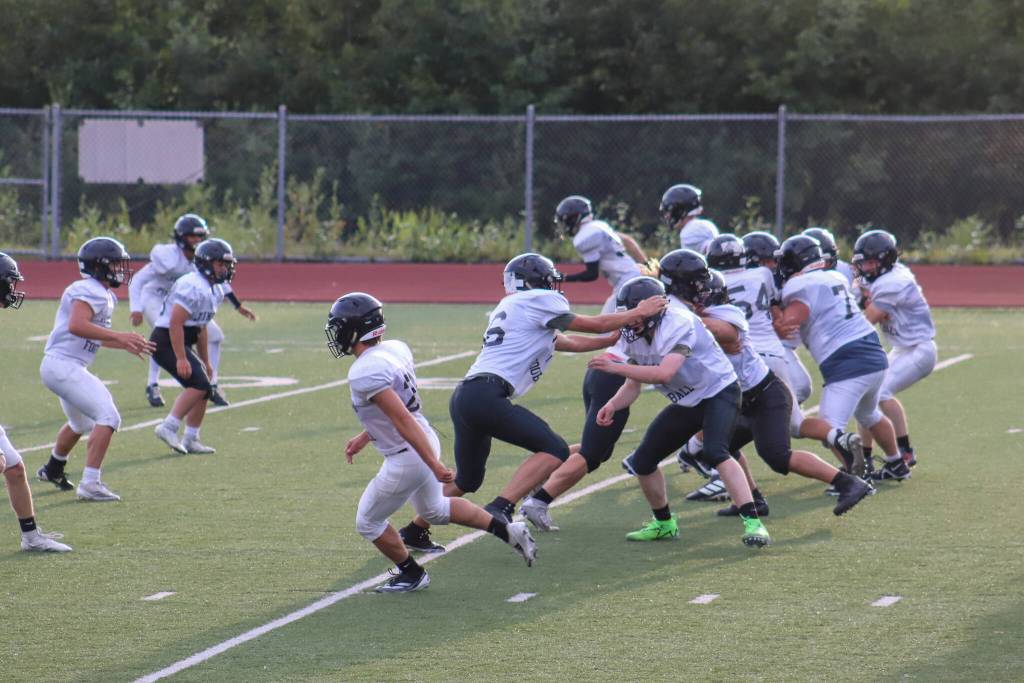 Juneau Huskies players scrimmage during practice on Tuesday at Thunder Mountain Middle School. (Jasz Garrett / Juneau Empire)