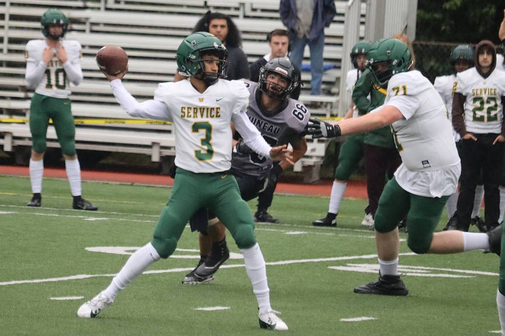 Service High School quarterback Taurian Phillip tries to throw against Juneau-Douglas High School: Yadaa.at Kalé during Saturdays game at Adair-Kennedy Memorial Park. (Mark Sabbatini / Juneau Empire)
