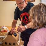 A Sitka youth and instructor build an energy efficient model home during a Southeast Renewable Energy Camp, a week-long exploration of Sitkas past, present and future energy resources. (Photo by Ryan Morse)