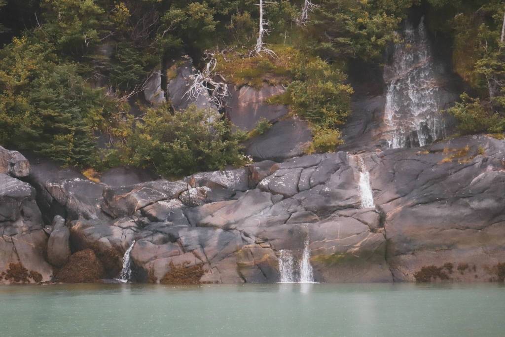 Waterfalls in Taku Inlet are seen during a boat excursion Tuesday by participants in the third annual Transboundary Mining Conference. Waters in the inlet are among those in Southeast Alaska of concern to tribes and other entities due to the impacts of mining in Canada in areas that flow into the waterways. (Jasz Garrett/ Juneau Empire)