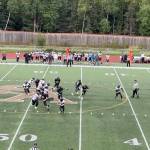 Caleb Ziegenfuss (left) looks to pass for the Juneau Huskies during Saturdays road game against South Anchorage High School. (Screenshot from Juneau Huskies Football livestream)