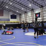 Students practice wrestling holds during a Juneau Youth Wrestling Club camp Sept. 1. (Mark Sabbatini / Juneau Empire)