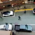 A screenshot from a rooftop phone video shows Steven Kissack running toward Juneau Police Department officer Terry Allen a moment before Kissack was fatally shot July 15. (Screenshot from video provided by JPD)