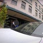 Steven Kissack is embraced by a friend about nine minutes into a confrontation with police on Front Street on July 15. (Screenshot from JPD bodycam video)