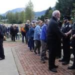 Juneau police officers receive thanks from attendees at a Sept. 11 commemoration ceremony Wednesday morning. (Mark Sabbatini / Juneau Empire)