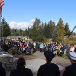 More than 100 local police, firefighters, military personnel and other people gather Wednesday morning at the September 11th Memorial at Riverside Rotary Park to observe the 23rd anniversary of the terrorist attacks that killed 2,996 people. (Mark Sabbatini / Juneau Empire)