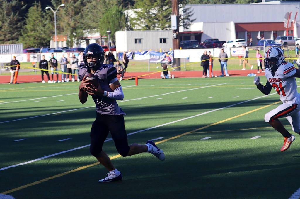 Juneau-Douglas High School: Yadaa.at Kalés Jayden Johnson (4) hauls in one of two touchdown passes from Noah Ault during Saturdays game against West Anchorage High School at Adair-Kennedy Memorial Park. (Mark Sabbatini / Juneau Empire)