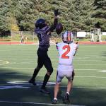 West Anchorage High Schools Ariel Sanchez (2) catches a Hail Mary pass beyond Juneau-Douglas High School: Yadaa.at Kalés Daniel Campbell and scores a touchdown to give the Eagles their first score at the end of the first half of Saturdays game at Adair-Kennedy Memorial Park. (Mark Sabbatini / Juneau Empire)