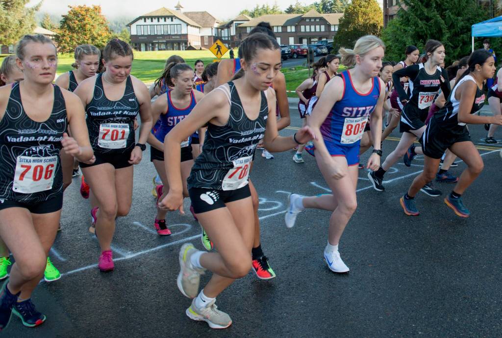 High school runners start the girls race at the Sitka Invitational Cross Country Meet on Saturday. (James Poulson / Sitka Sentinel)