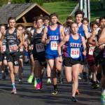 Juneau-Douglas High School: Yadaa.at Kalé  and Sitka High School runners lead the start of the boys race at the Sitka Invitational on Saturday. Sitka's Claire Mullin (810) ran in the boys race as she continues to prepare for college running after this season. (James Poulson / Sitka Sentinel)