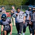 Juneau-Douglas High School: Yadaa.at Kalé freshman assistant coach and manager Jaasyah Crowley (72) directs varsity warmups before the Juneau Huskies’ game against West Anchorage High School last Saturday at Adair-Kennedy Memorial Park. (Klas Stolpe / For the Juneau Empire)