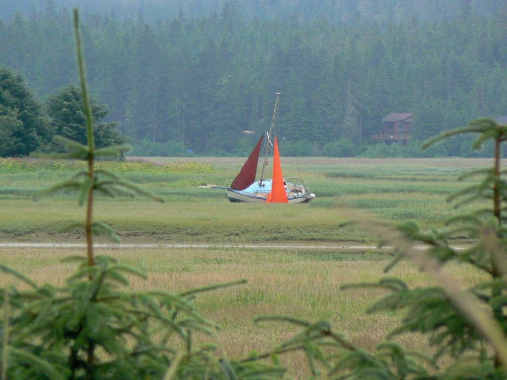 Boats attempting to cross the Mendenhall bar at high tide, short cutting the route between downtown and Auke Bay occasionally run aground and get stuck as this sailboat did for several days in 2007. (Laurie Craig / Juneau Empire)