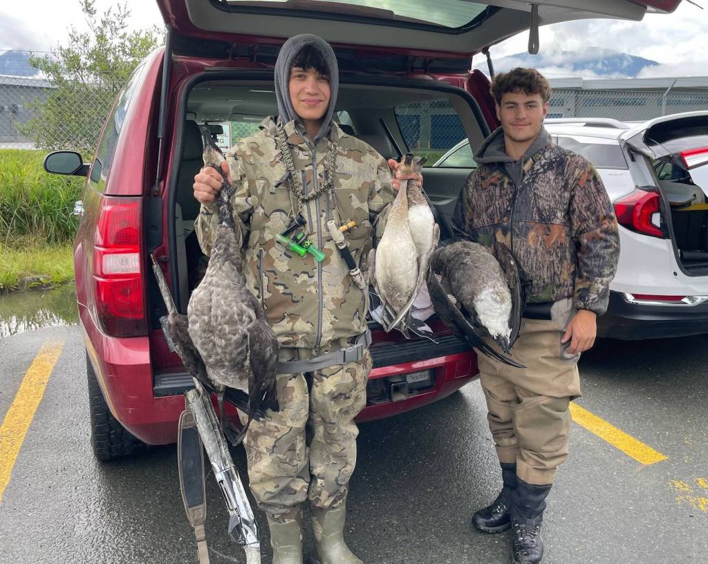 Juneau-Douglas High School: Yadaa.at Kalé students Justin Geary and Justus Darbonne, both 17, show ducks and geese they hunted on Sept. 2, 2024, during the waterfowl season opening reserved for youngsters. Students were crucial to the successful passage in 1976 of legislation establishing the Mendenhall Wetlands State Game Refuge. (Laurie Craig / Juneau Empire)