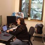 Wendy Kah Skaahluwaa Todd works on a presentation about using traditional as well as Western knowledge in healthcare in her office at the new Áakʼw Tá Hít building at the University of Alaska Southeast on Friday. (Mark Sabbatini / Juneau Empire)