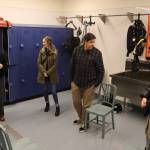 Visitor tour the wetsuit room at the new Áakʼw Tá Hít building at the University of Alaska Southeast on Friday. (Mark Sabbatini / Juneau Empire)
