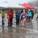 Sitka High Schools Marina Dill crosses the finish line to win the girls 5K at the Capital City Invite on Saturday at Savikko Park. (Mark Sabbatini / Juneau Empire)