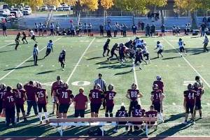 Caleb Ziegenfuss rolls out to pass for Juneau-Douglas High School: Yadaa.at Kalé during Saturdays game against Dimond High School in Anchorage. (Screenshot from Juneau Huskies Football livestream)