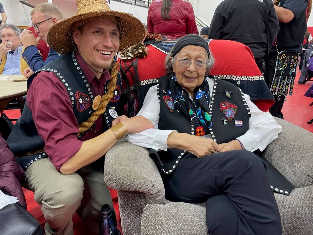 Tim Demmert and his grandmother, Ruth, share a moment of appreciation during a ceremony Saturday at Kakes community hall where the Navy offered a formal apology for the bombardment of the village in 1869. (Laurie Craig / Juneau Empire)