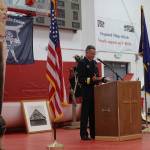 U.S. Navy Rear Adm. Mark Sucato reads the militarys formal apology for the bombardment of Kake in 1869 during a ceremony at the villages community hall on Saturday. (Laurie Craig / Juneau Empire)